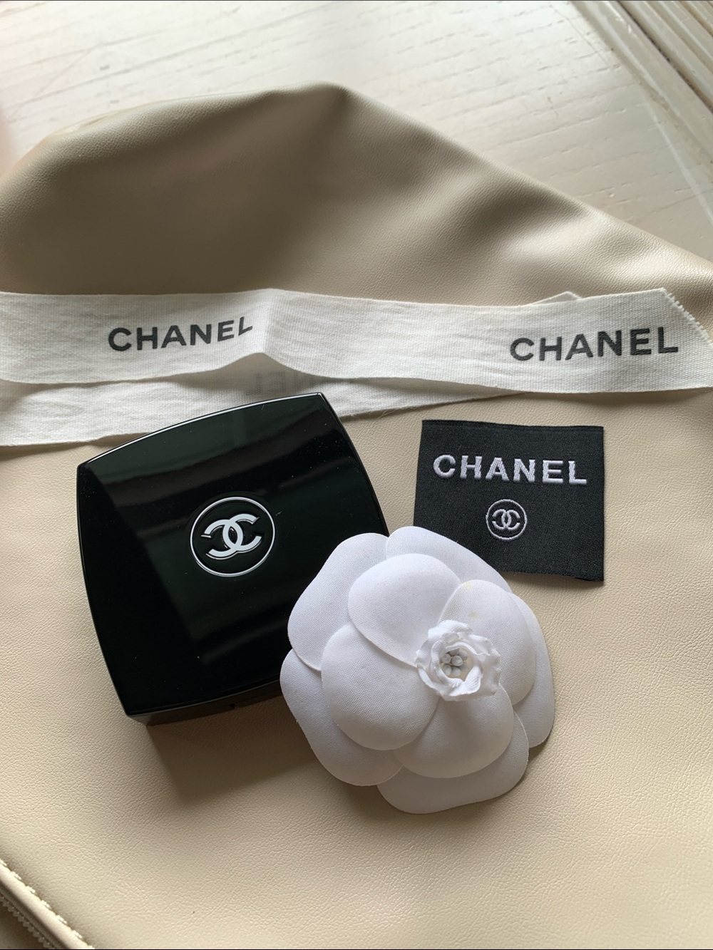 CHANEL Black Compact with White Camellia and Branded Ribbon